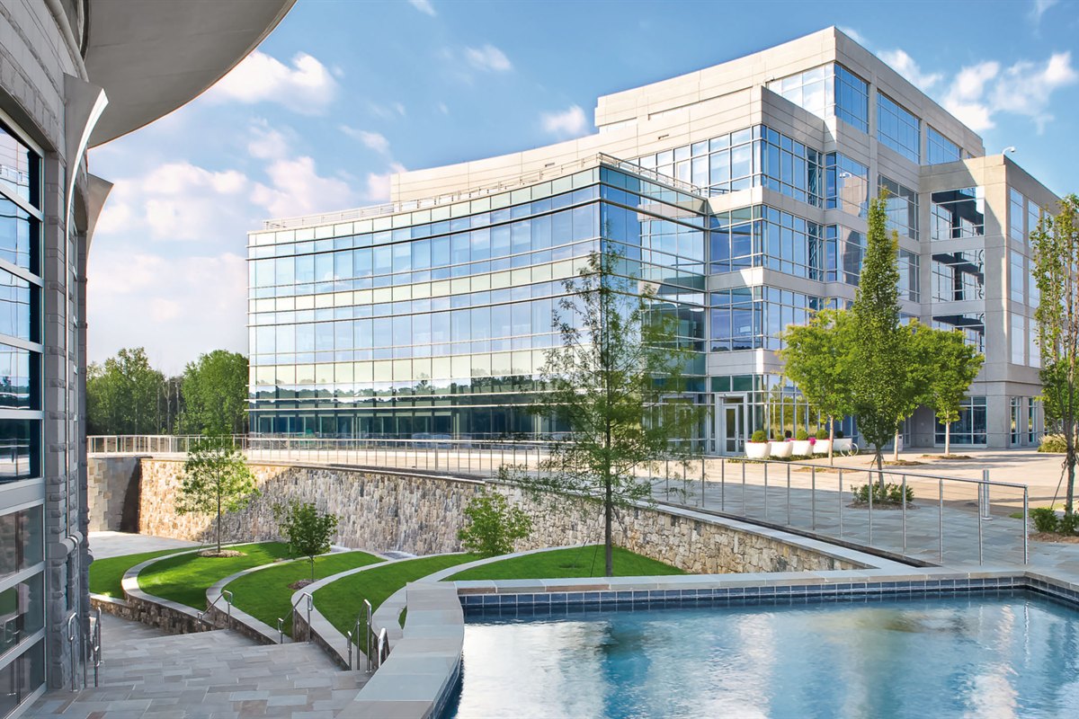 Terraced lawns, courtyard plantings and water feature at a corporate office campus