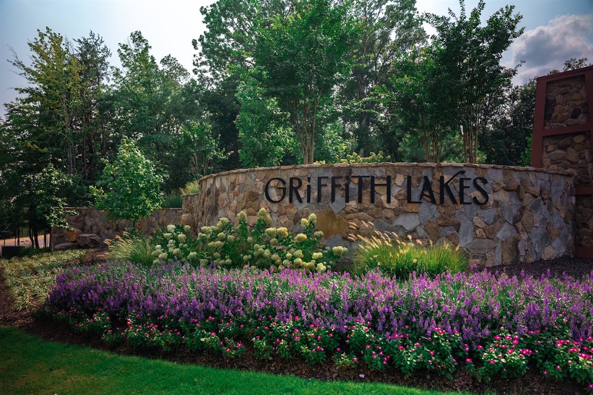 Griffith Lakes stone entrance wall with seasonal color, Charlotte, NC