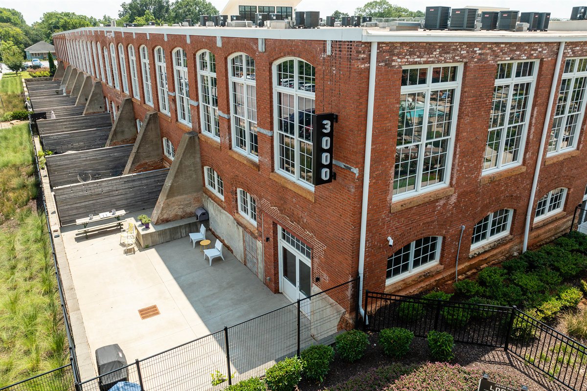 Foundation plantings and courtyard at a mixed-use mill redevelopment
