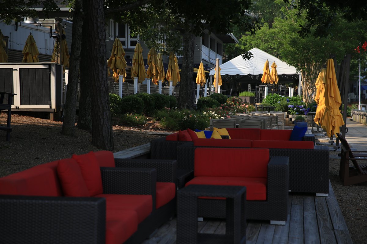 Planting beds and hydrangeas along a waterfront restaurant patio
