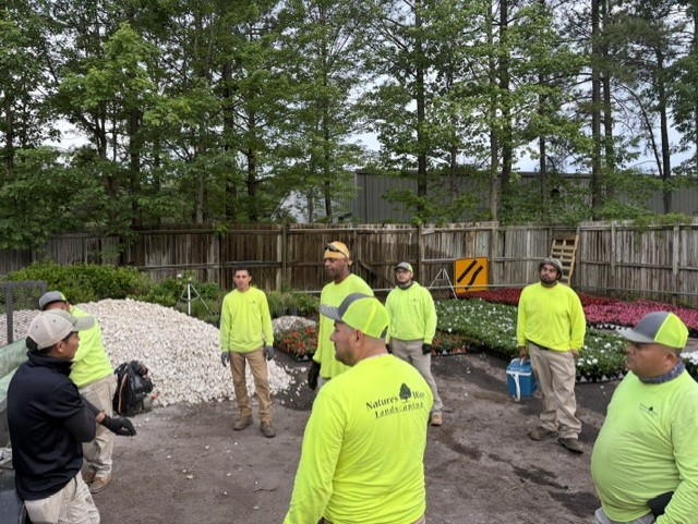 Richmond crew members gathered for a morning huddle in the yard