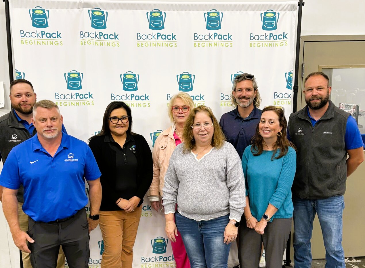 Granite Hills Triad team members with community partners at a Backpack Beginnings event